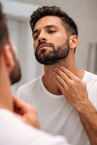 Checking the skin beneath facial hair